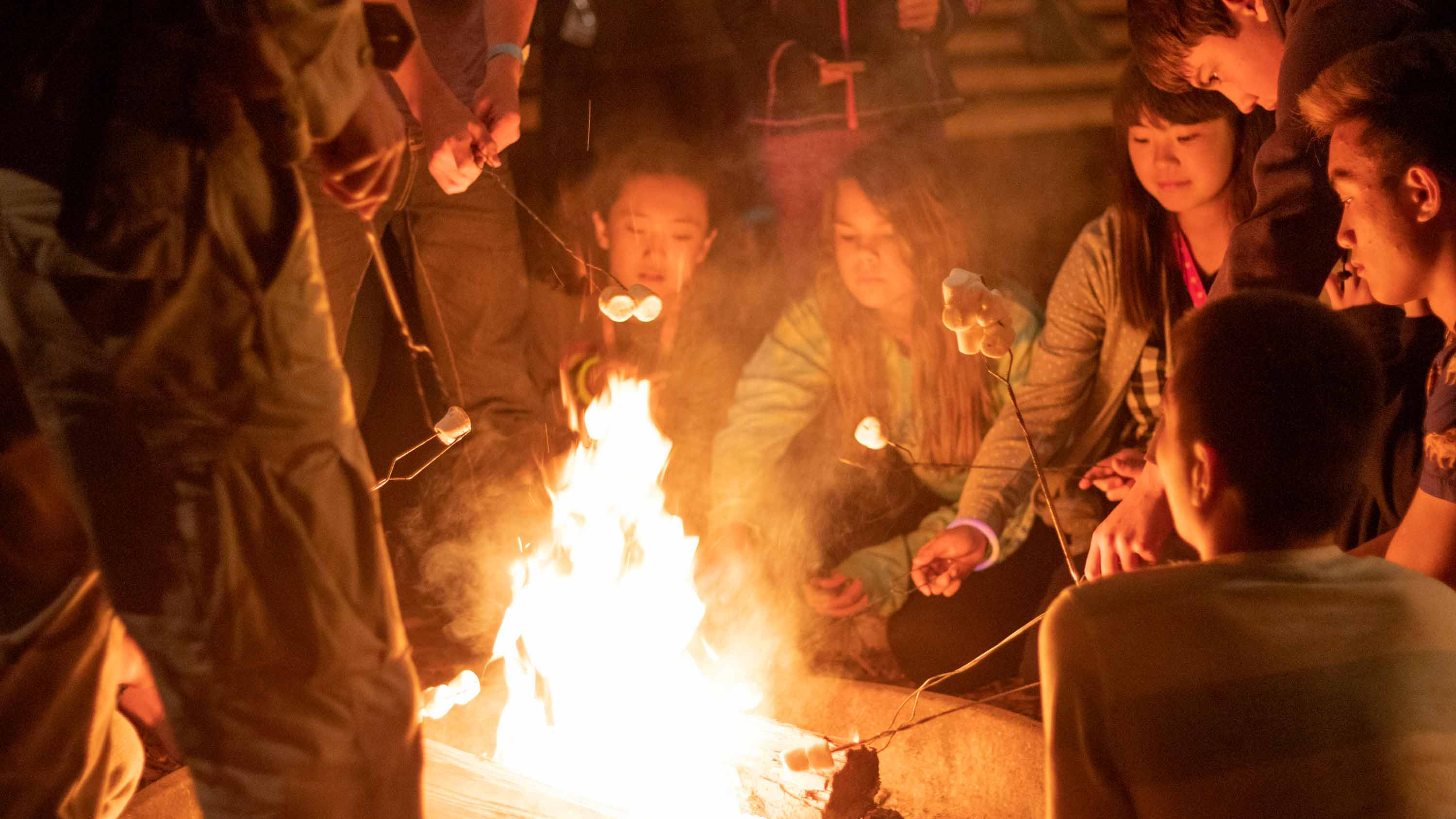 CRISTA Camps Family Camp - Campers Roasting Marshmellows