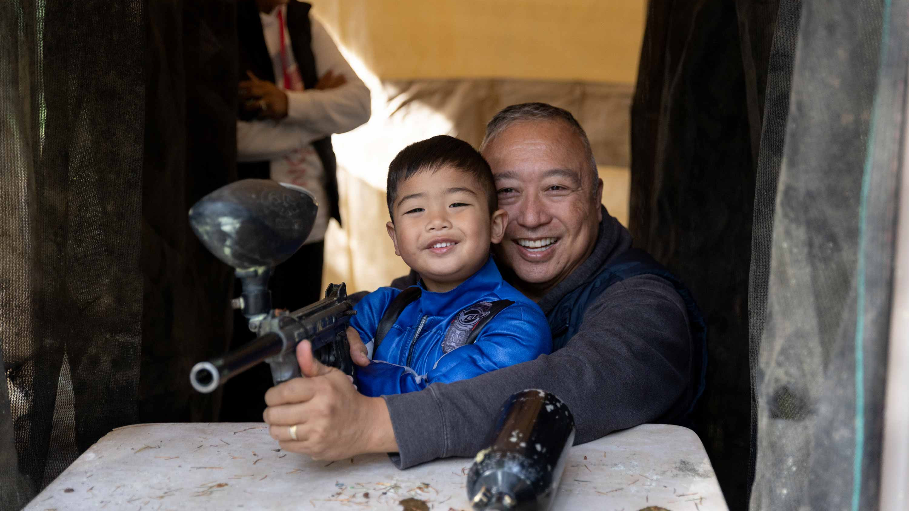 CRISTA Camps Family Camp - Dad and Son Playing Paint Ball