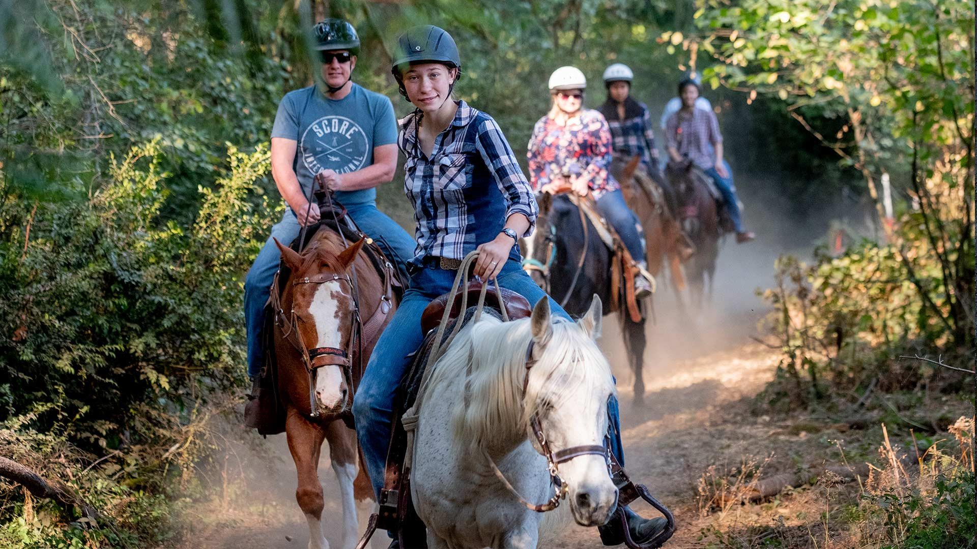 CRISTA Camps at Miracle Ranch Adults - Riding horses on trail