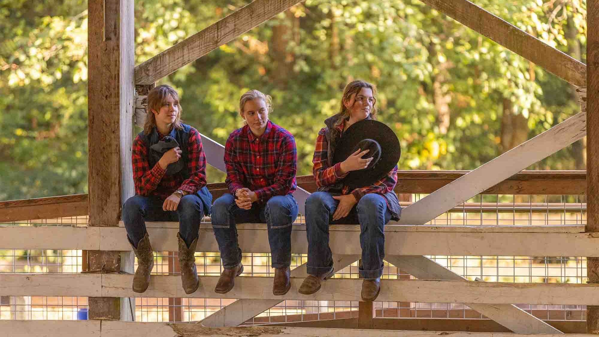 CRISTA Camps Staff - Employees Sitting on Fence