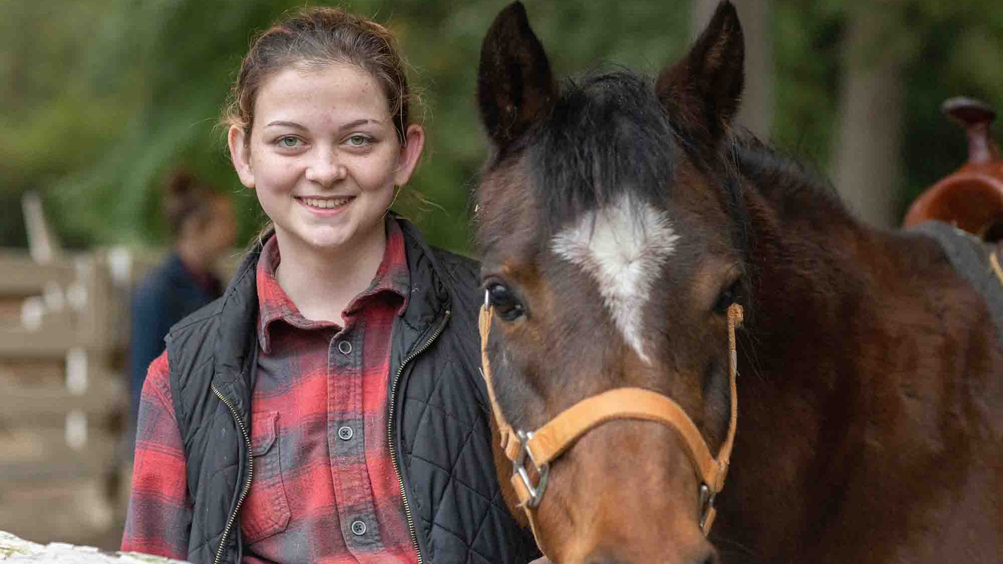 CRISTA Camps Staff - Staff Taking Care of Horse